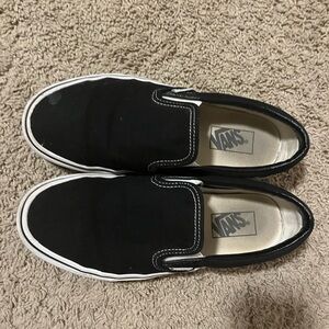 Black Slip-on Vans in good condition.